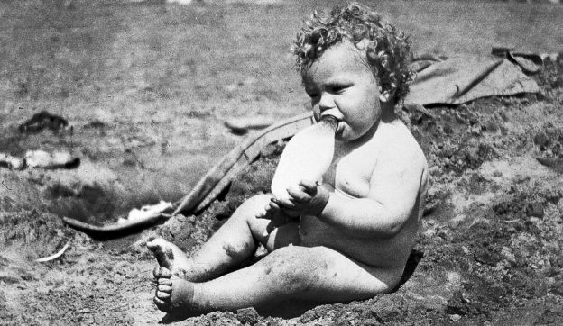 baby with feeding bottle 1922