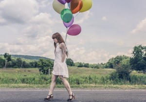 lonely woman with balloons